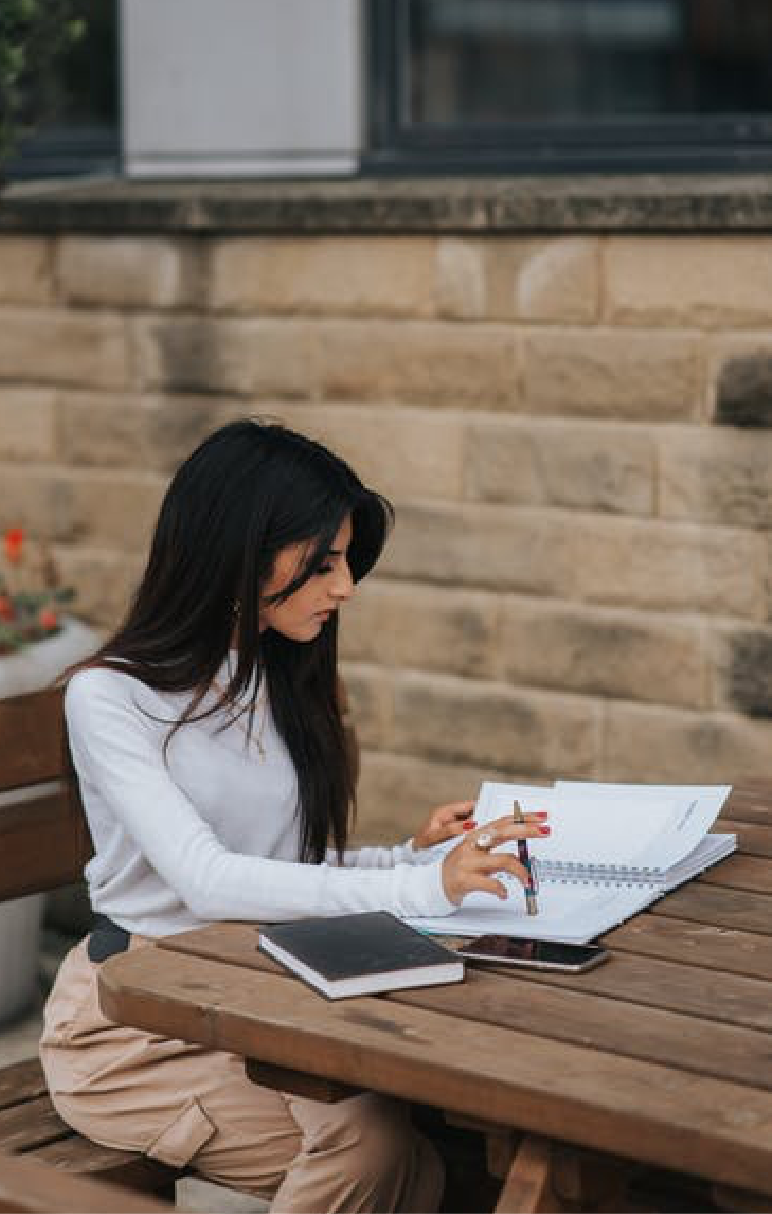 woman studying out on table