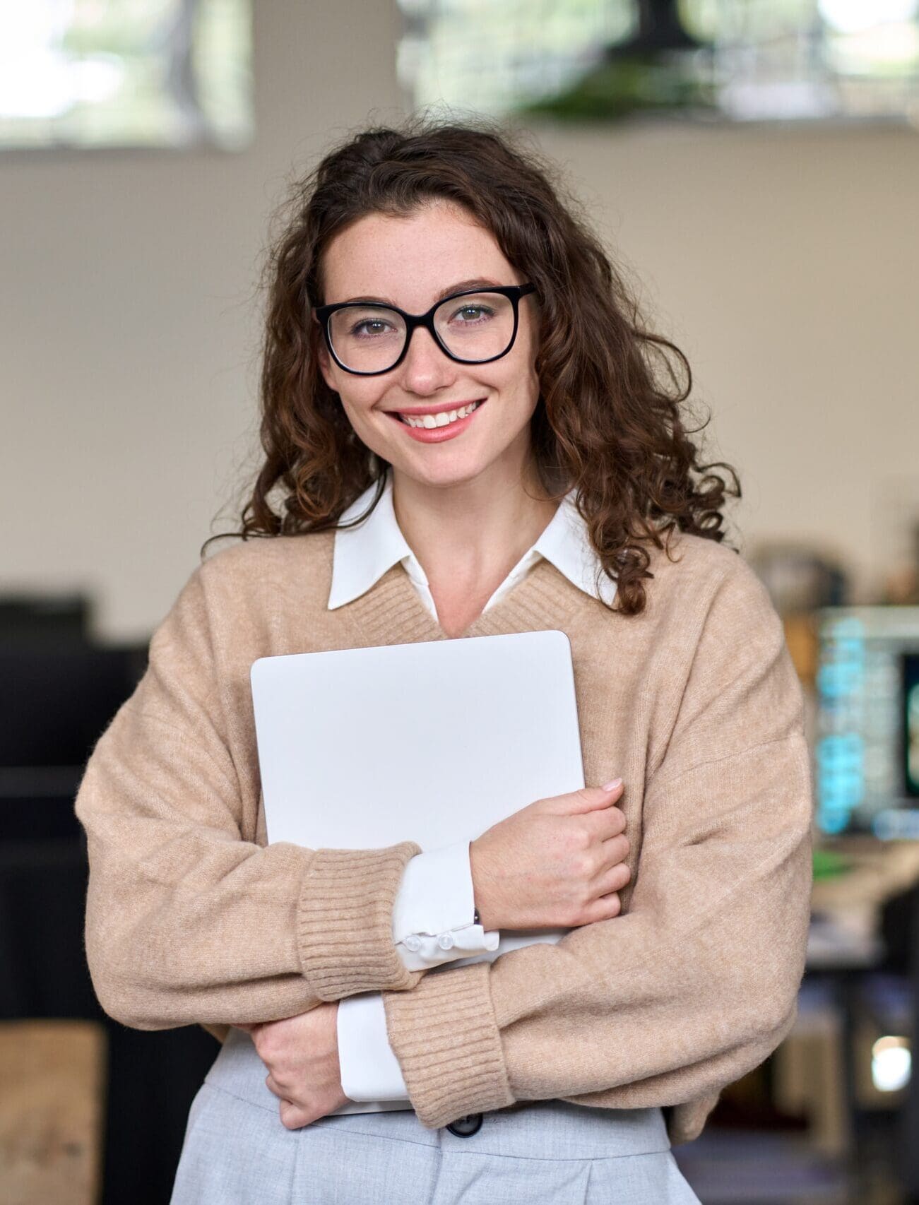 ihl-woman-generic-headshot Girl smiling while holding tablet